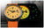 Vista de reloj para hombre: esfera amarilla con correa naranja, reloj negro parcialmente visible