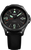 Reloj de hombre con esfera negra, índices luminosos y fecha "83"
