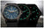 Tres relojes de pulsera uno al lado del otro con correa negra y esfera que brilla en azul o verde