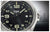 Esfera de reloj para hombre, negra con índices luminosos y manecillas plateadas.