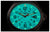 Reloj de hombre con caja negra, esfera turquesa luminosa y correa textil negra