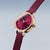 "Reloj de mujer con correa morada, caja redonda en tono oro rosa y esfera lila con índices."