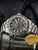 Pulsera de reloj para hombre Traser con bisel plateado y esfera oscura, índices amarillo-azulados