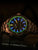 Pulsera de reloj para hombre Traser con bisel color bronce e índices luminosos azules, acentuado en verde