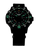 Pulsera de hombre con esfera negra, índices luminiscentes verdes y correa negra.