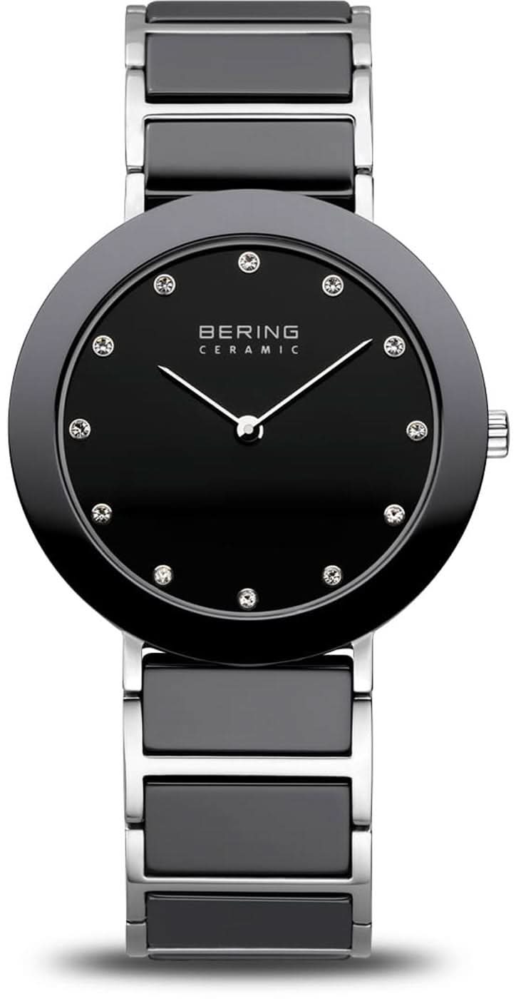Reloj de mujer con esfera negra, índices y bisel de cerámica en brazalete de acero inoxidable.