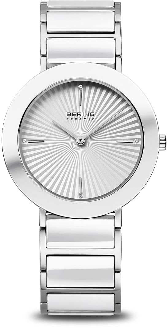 Reloj Bering para mujer con pulsera de metal plateado, esfera redonda con patrón de rayos