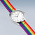 Reloj Bering con caja plateada, esfera blanca y correa textil multicolor arcoíris
