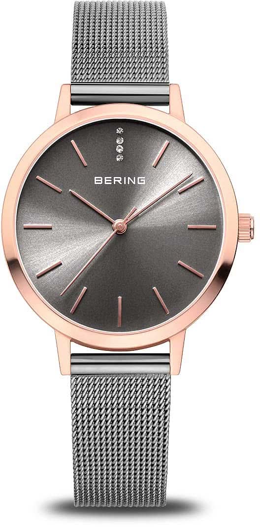 Reloj Bering para mujer con correa milanesa plateada, esfera oscura y bisel en oro rosa
