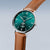 Reloj de pulsera para hombre con esfera verde, correa de cuero marrón y bisel plateado.