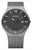 Reloj de hombre con esfera negra, manecillas naranjas y pulsera de malla metálica, caja redonda