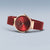 Reloj Bering para mujer con correa de malla roja, caja redonda en tono oro rosa y esfera roja