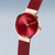 Reloj Bering para mujer con bisel oro rosa, esfera roja y correa de malla roja