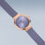 Reloj de mujer: bisel oro rosa, esfera azul con índices y manecillas, correa de malla