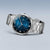 Pulsera de hombre con caja redonda plateada, esfera azul y brazalete de metal
