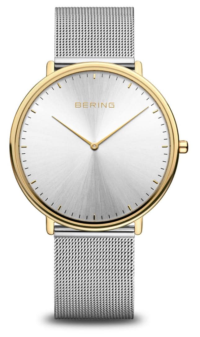 Reloj de hombre con esfera blanca, caja dorada y correa de malla plateada.