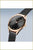 "Reloj de mujer con esfera negra, bisel en oro rosa, correa de malla milanesa"