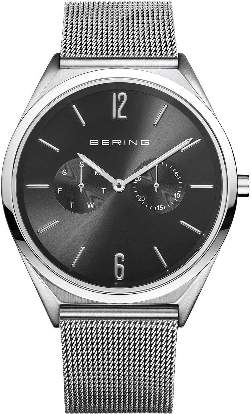Reloj con esfera oscura, correa Milanesa y caja plateada, cristal de zafiro