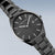 Reloj Bering Ultra-Slim para hombre con esfera oscura, índices y correa de acero inoxidable.