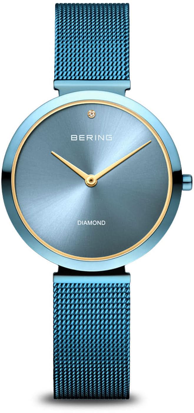 "Reloj de mujer con correa de malla azul, esfera redonda azul y bisel dorado"