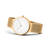 Bering Armbanduhr, schräg fotografiert: goldfarbenes Gehäuse und weißes Zifferblatt