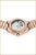 "Reloj de mujer con pulsera de metal en oro rosa, fondo de caja transparente y movimiento visible"