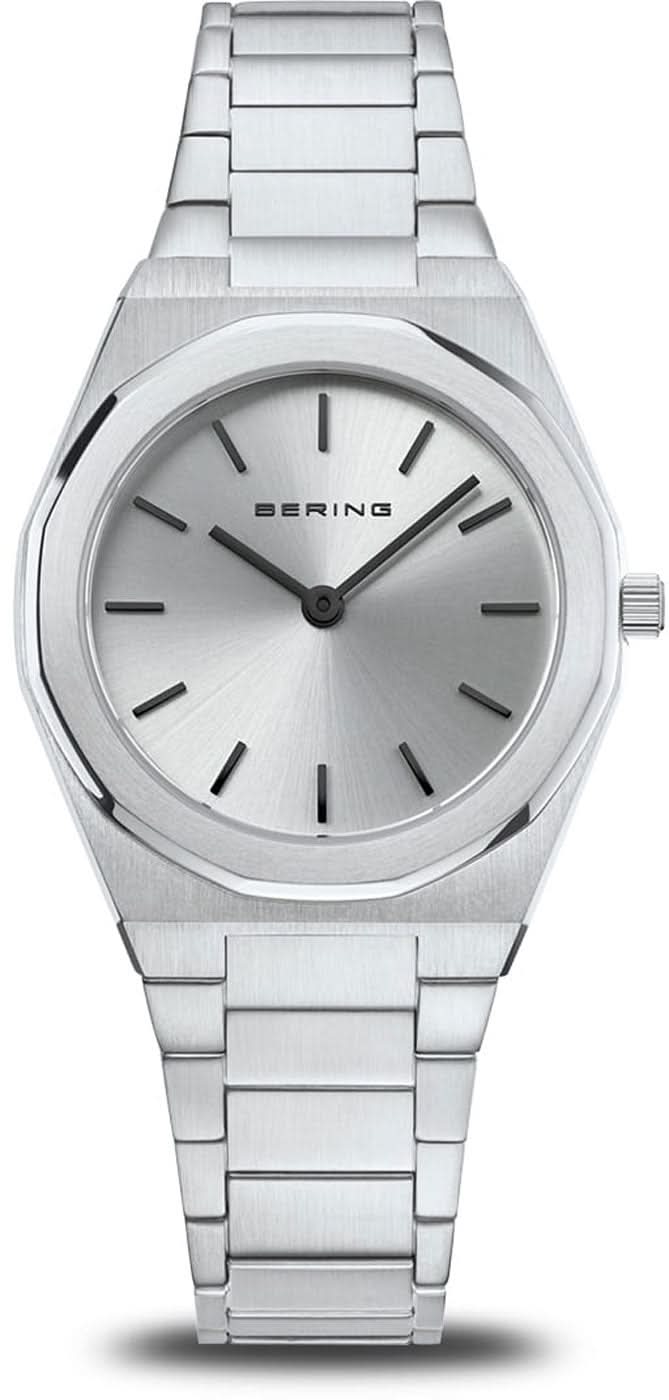 Reloj Bering para mujer con correa de metal plateado, esfera redonda e índices