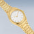 Reloj dorado de mujer con caja redonda, esfera blanca y brazalete de metal