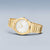 Reloj dorado para hombre con caja redonda, esfera blanca y correa milanesa