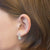 Pendientes de aro estilo criollo en color plateado con piedras de colores