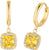 Aros dorados con colgante de piedra amarilla y borde de piedra brillante
