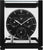 "Reloj de mesa de metal con esfera negra y manecillas en un marco de caja abierto"