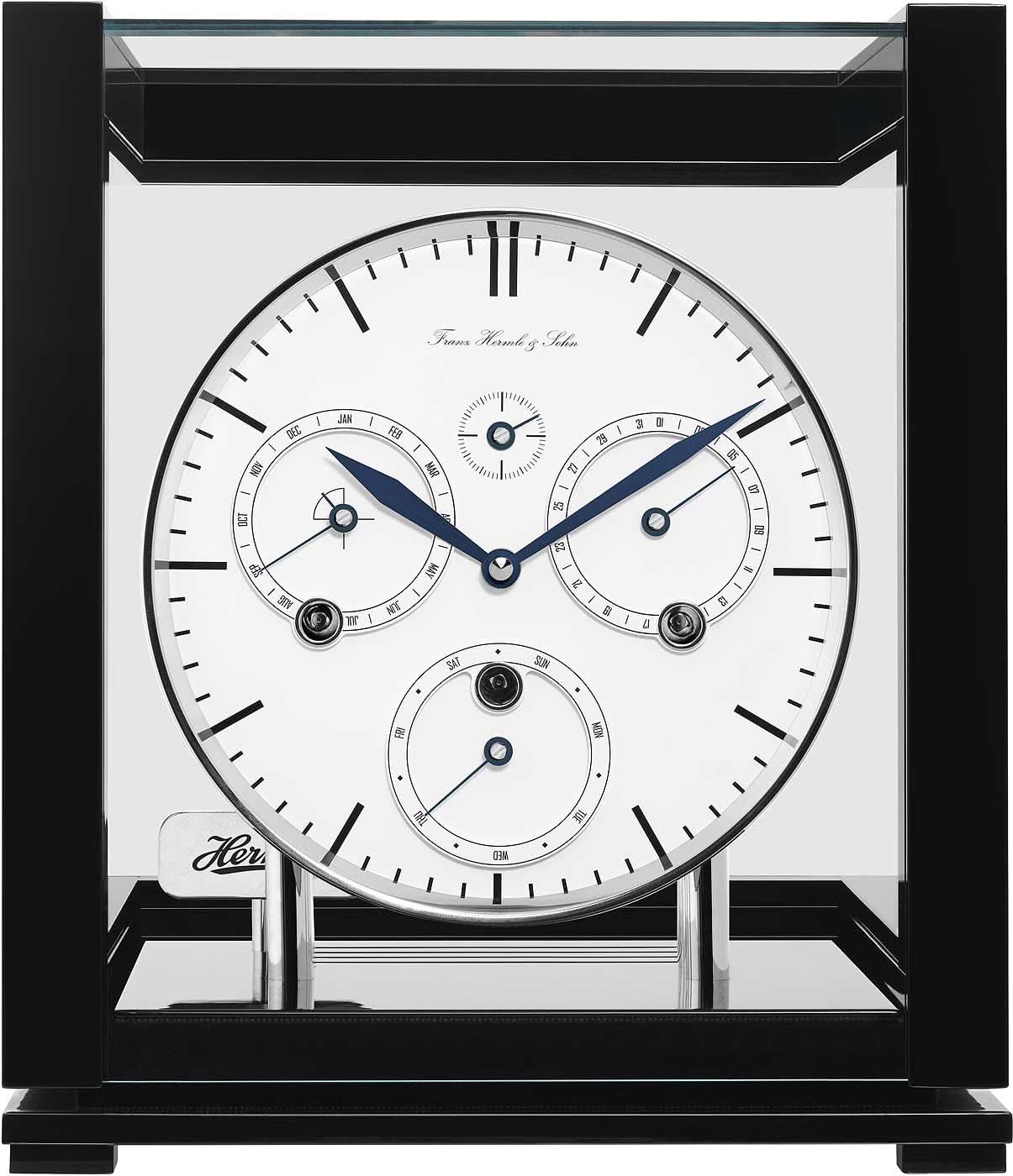 Reloj de mesa con esfera blanca, manecillas azules y marco de madera oscura