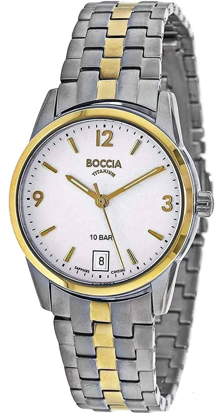 Reloj de mujer con pulsera de metal plateado, detalles dorados y esfera clara.