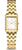 "Reloj de mujer con pulsera de acero inoxidable en tono dorado y caja rectangular, esfera blanca"