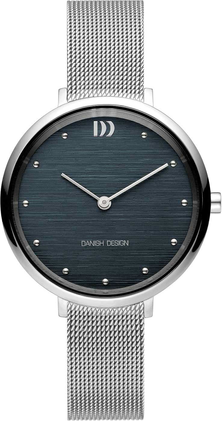 Reloj de mujer con esfera redonda azul oscuro y pulsera de malla plateada, índices y manecillas.