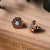 Pendientes de madera con nácar azul, bisel redondo en detalle
