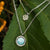 Collar de plata en capas con colgante grande de nácar redondo y charm pequeño con motivo brillante