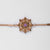 Pulsera con eslabón de cadena en tono dorado y colgante de copo de nieve con piedra morada