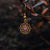 Colgantes de oreja con colgante de copo de nieve en tono dorado y piedra decorativa morada