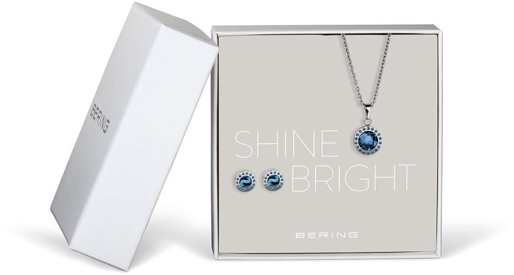 Conjunto de joyas con collar plateado, colgante azul redondo y pendientes de botón azules