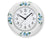 "Reloj de pared de cerámica, redondo, blanco con flores azules; esfera y manecillas."