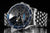 Reloj para hombre con esfera negra, bisel azul y brazalete de eslabones de acero inoxidable