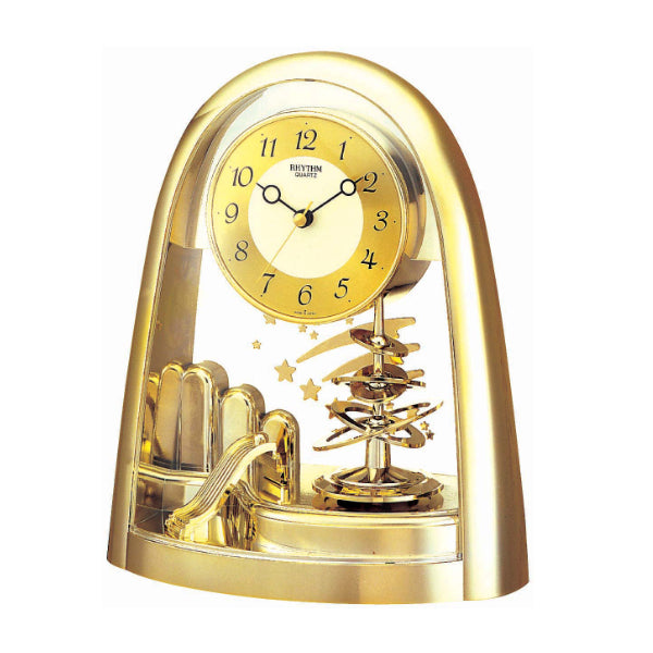Goldene Tischuhr mit rundem Zifferblatt und sichtbarem Drehpendel