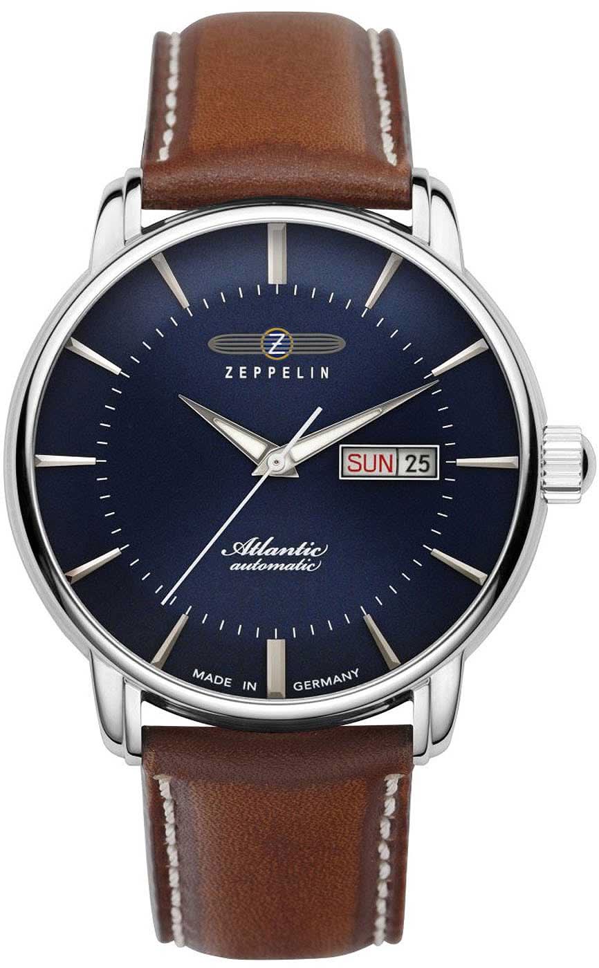 Reloj de hombre con esfera azul, correa de cuero marrón y visualización de día y fecha a las 3
