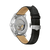 Vista trasera de reloj para hombre con correa de cuero negra y movimiento visiblemente abierto