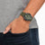 Reloj Citizen Promaster para hombre en la muñeca con correa y esfera verdes