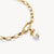 Collar dorado con colgante de perlas: lazo y piedra rosa