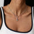Collar de plata con pequeño charm de Snoopy y piedra de colores