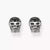 Pendientes de calavera plateados con piedras decorativas negras